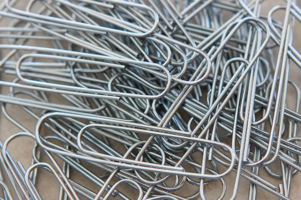 You do not need to remove paper clips and staples before recycling paper.