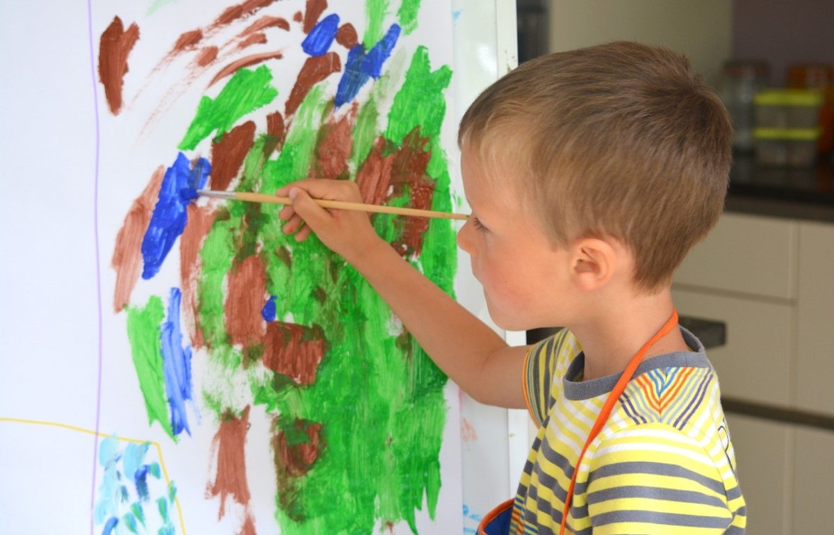 young boy painting