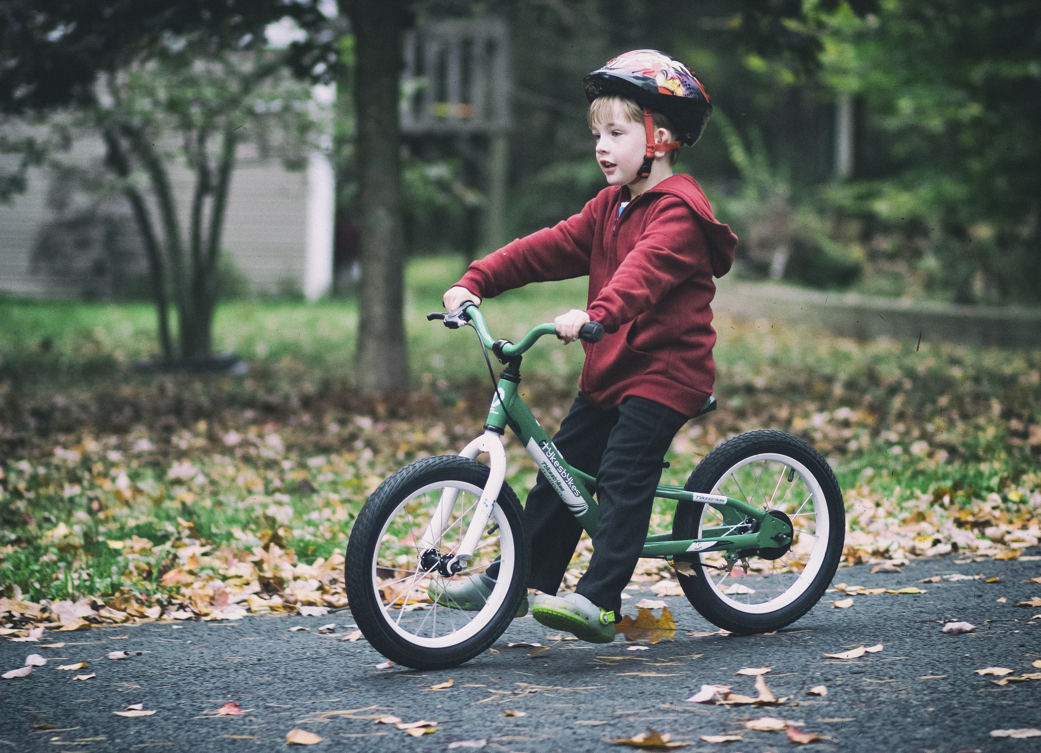 child on balance bike