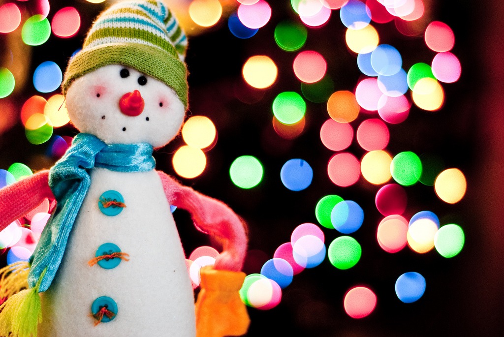 Snowman in front of Christmas Tree