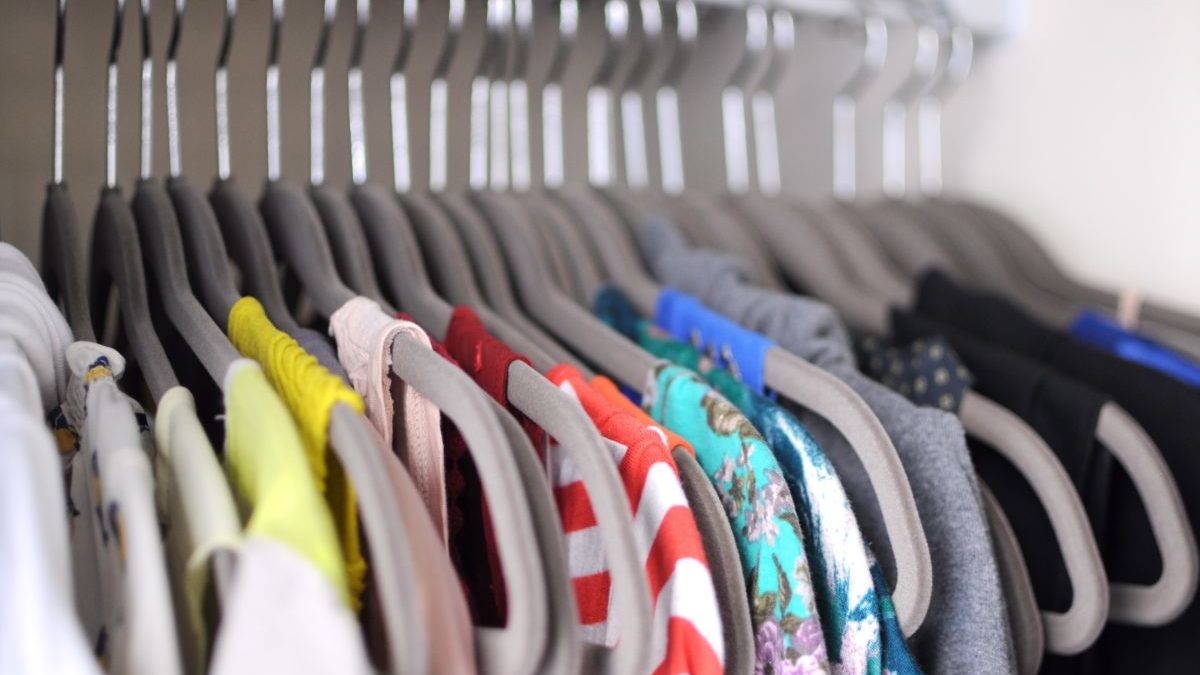 organized clothes in closet