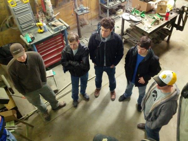 Farmlogs team chats in the shop. 