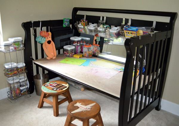 Repurposed Crib Becomes Craft Center. Image courtesy of Red Pill Mom. 
