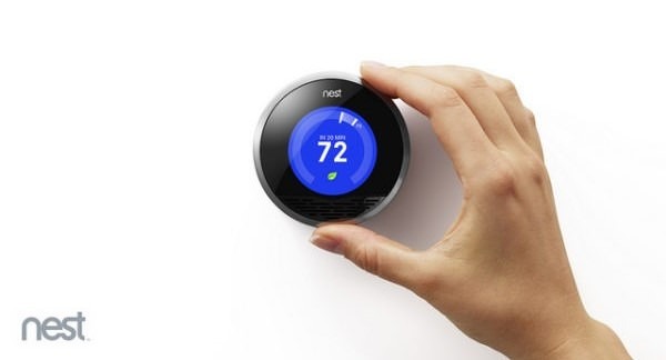 hand on thermostat control