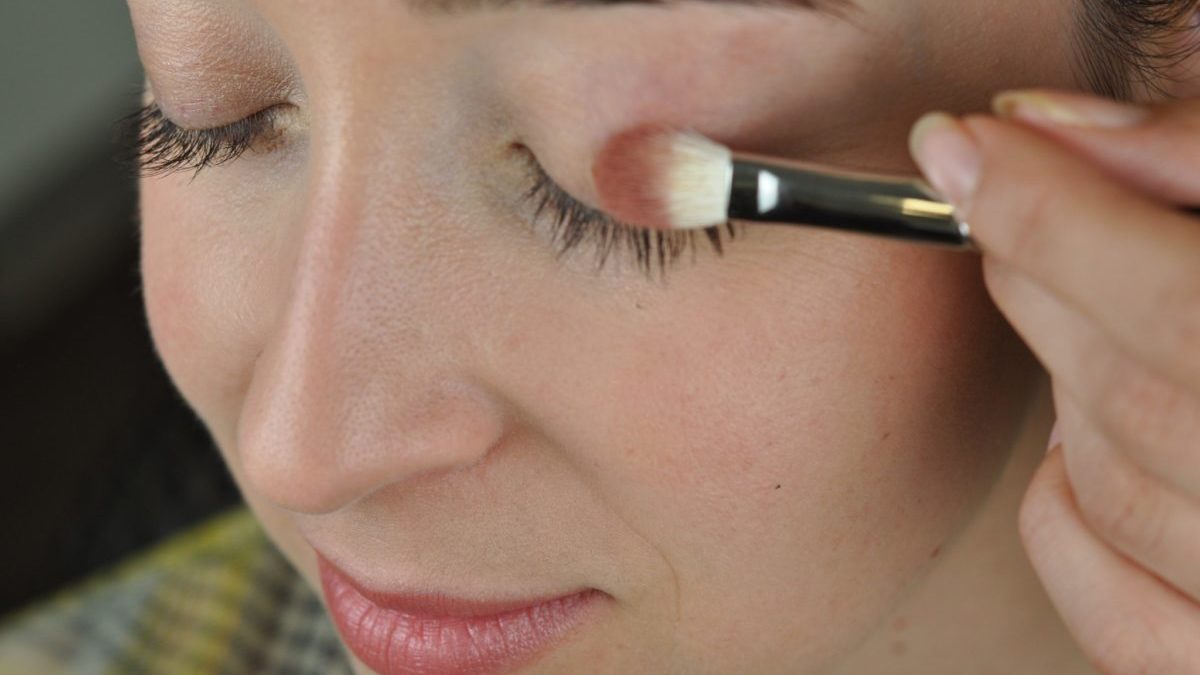 Woman applying eco-friendly makeup