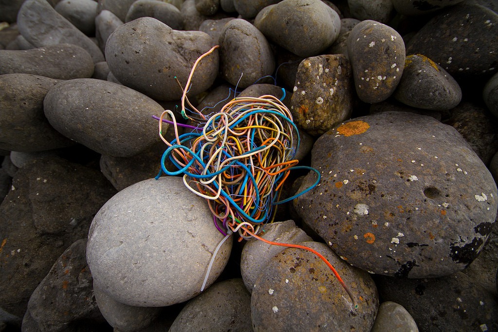 E-waste debris on ocean rocks