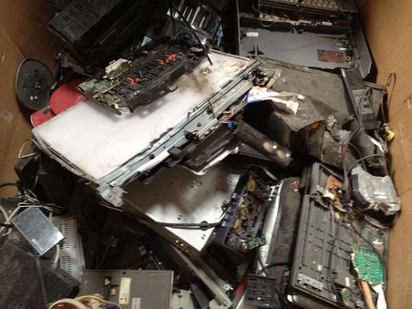 box full of smashed e-waste
