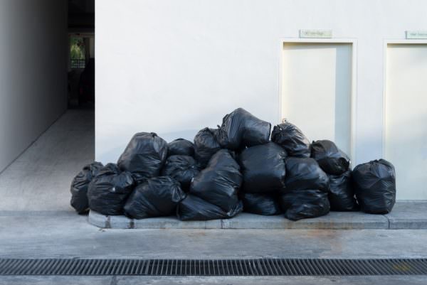 Waste bagged outside building