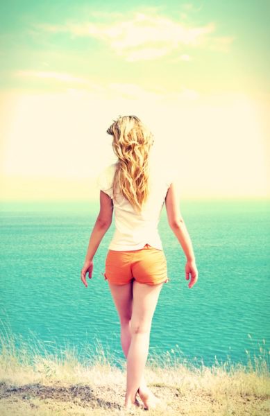 girl on the beach wearing sunscreen
