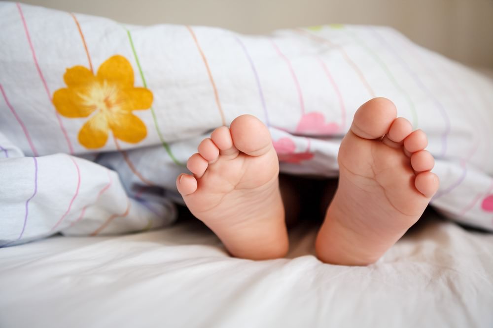 baby's feet under DIY duvet cover