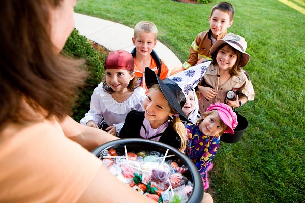 Limiting the number of houses your kids trick-or-treat at can cut down on waste (and sugar overload!). Photo credit: Shutterstock.com