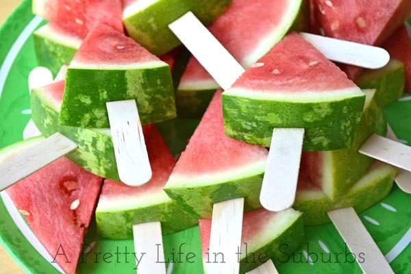 watermelon wedges on wooden popsicle sticks