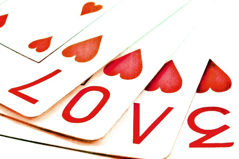 Playing cards spell out "LOVE"