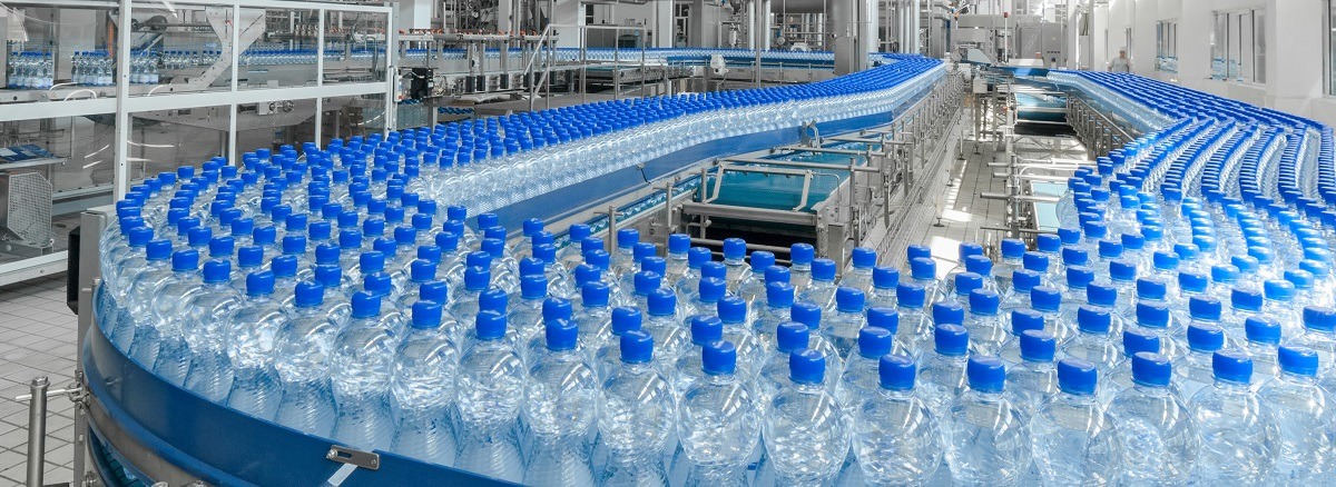 plastic bottles of water on a factory conveyor belt