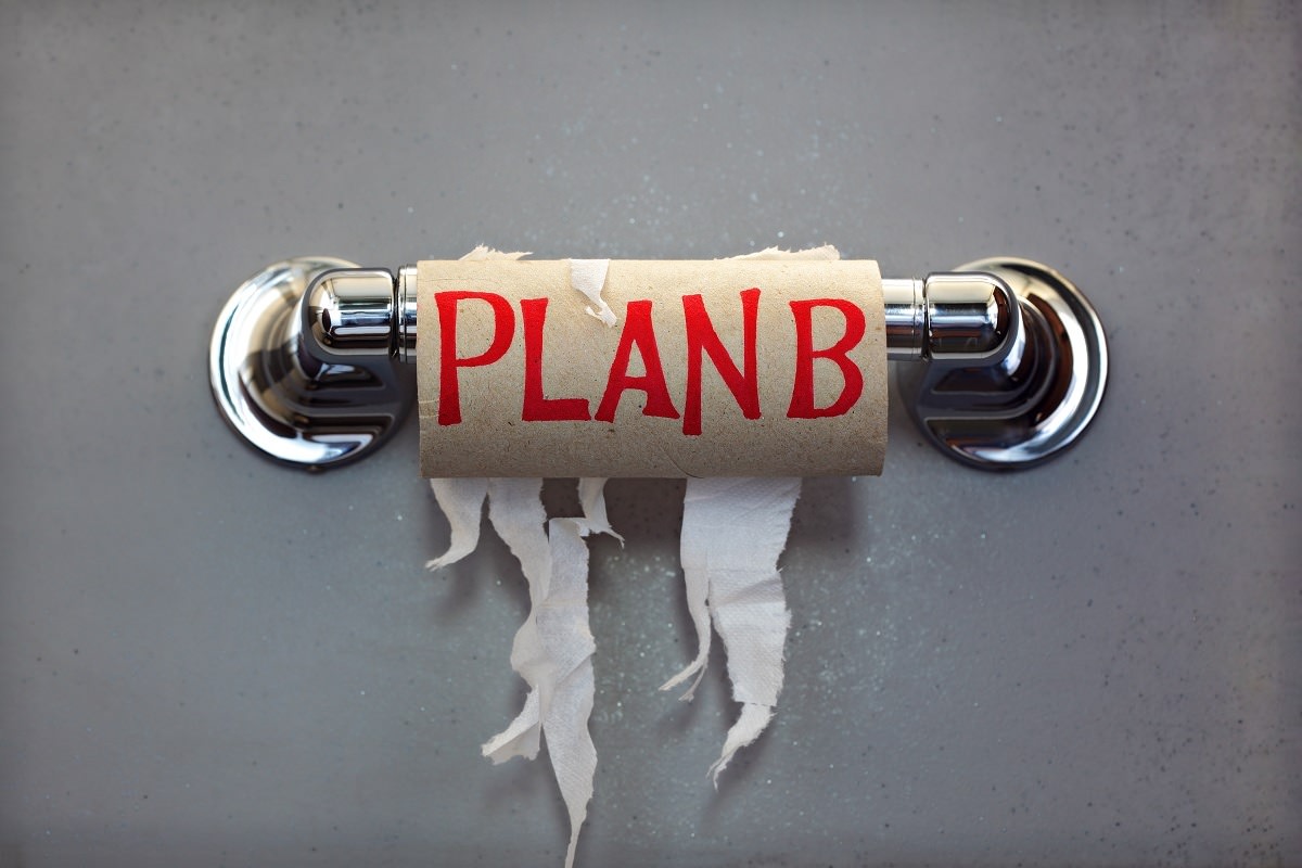 Empty roll of toilet paper with the phrase Plan B on cardboard center