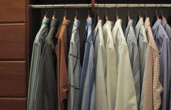 men's dress shirts hanging in closet