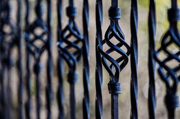close-up detail of wrought iron fence