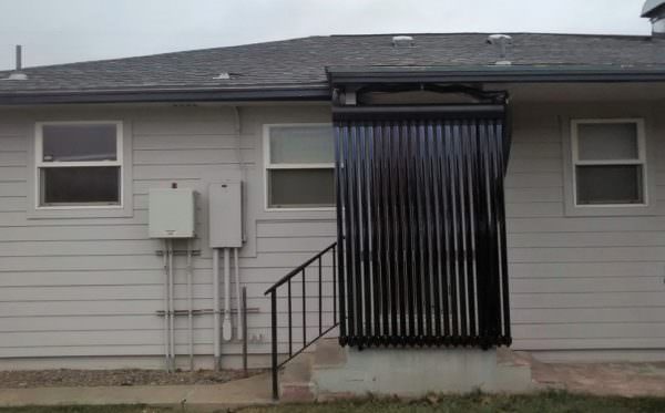 Solar water heating panels screen a residential front door