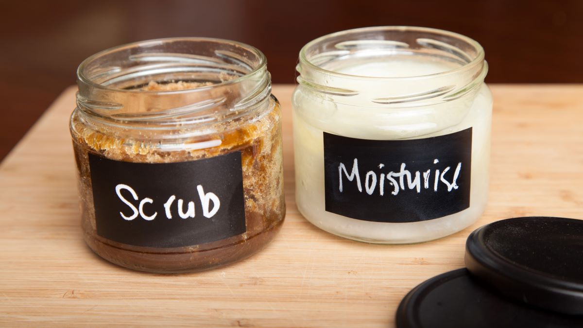 Jars of homemade skincare scrub and moisturizer