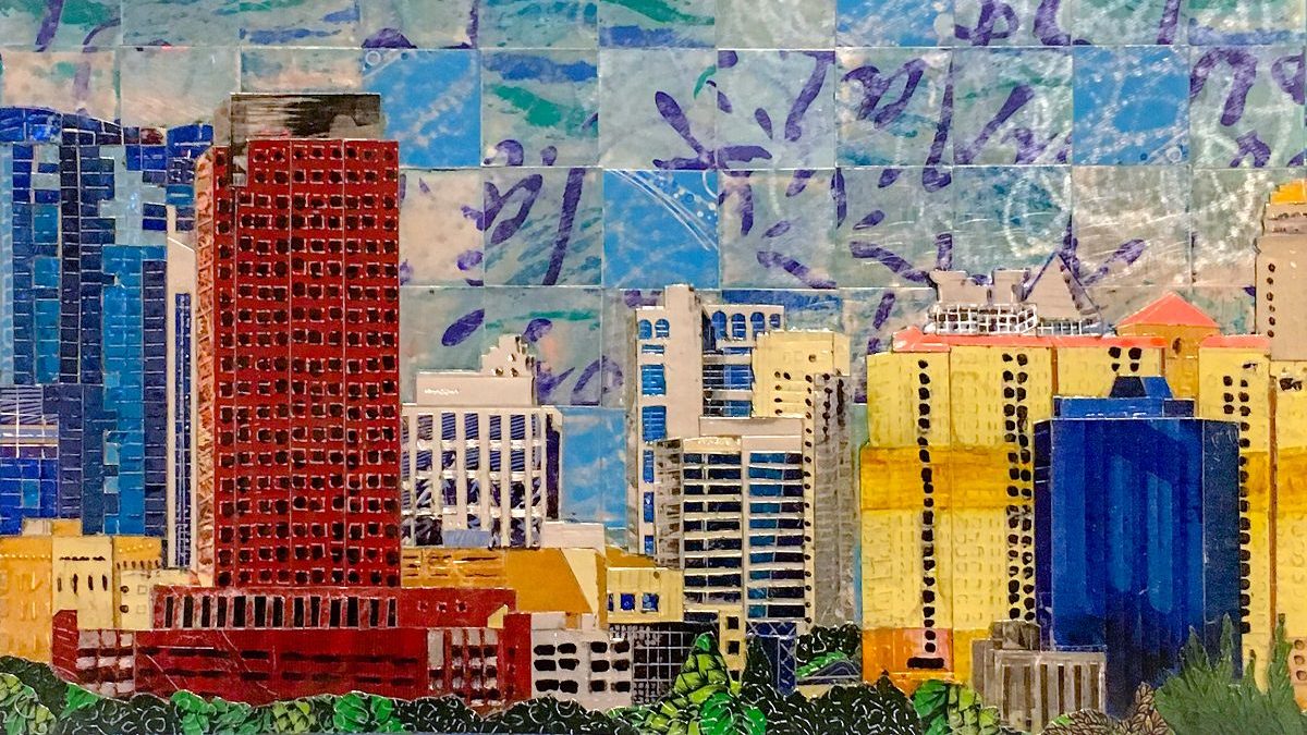 city skyline from upcycled beverage cans