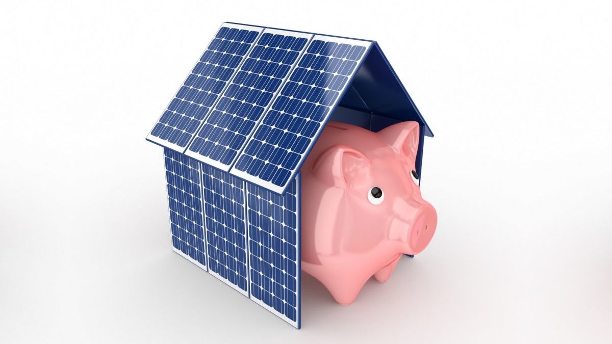 piggy bank in a house of solar panels