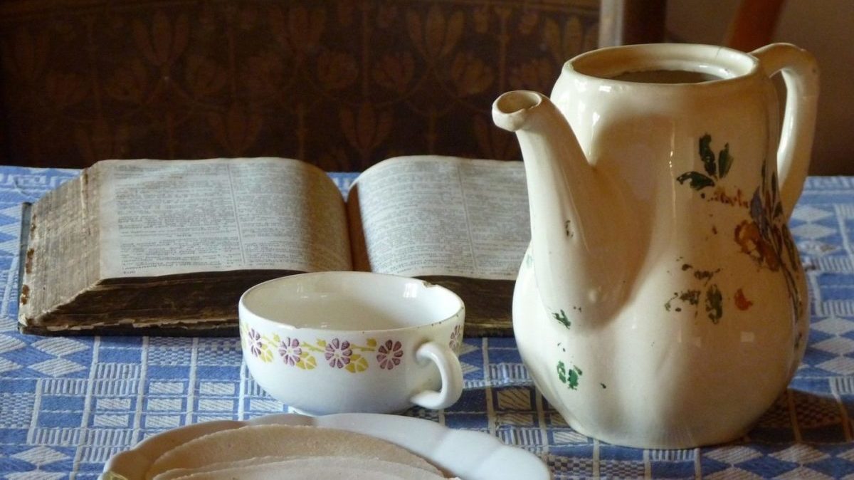 chipped cup and worn teapot
