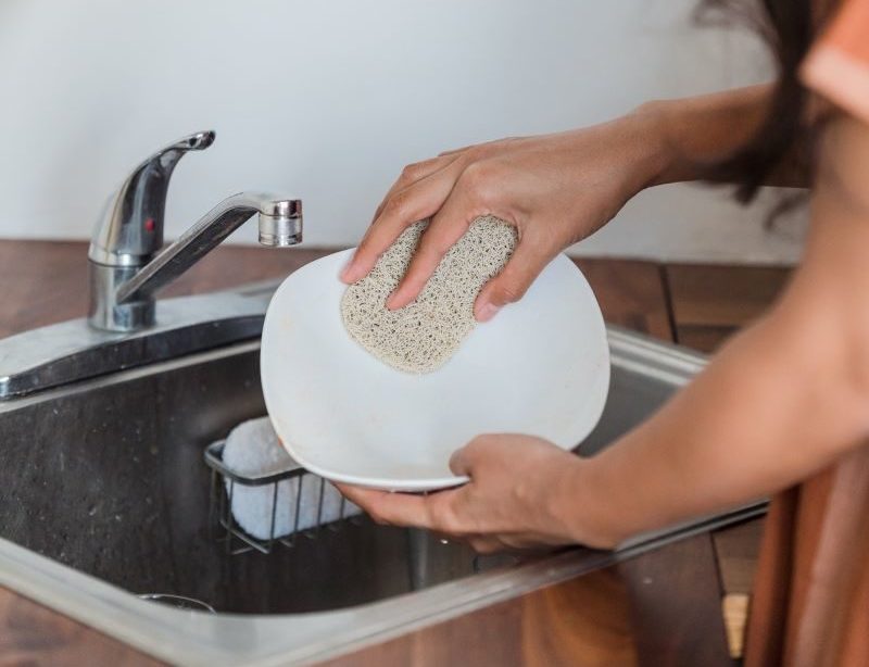 washing dishes with natural scrubber