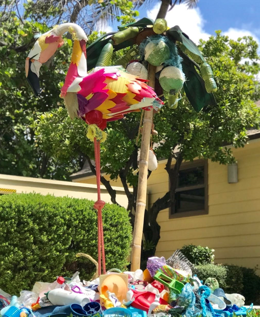 Frida the Flamingo on Plastic Island, an island of debris retrieved from beach clean-ups, is among art pieces featured at a World Oceans Day event in South Florida. Sculpture: Kurt Wiese of Free Our Seas & Beyond