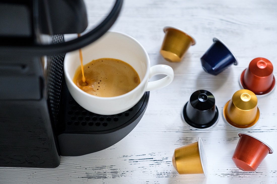 espresso brewing, disposable coffee pods on table