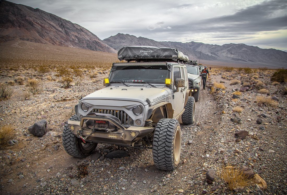 jeeps on desert road