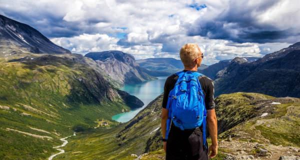 hiker looking at mountains in Norway