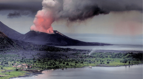 volcano erupting on ocean coast