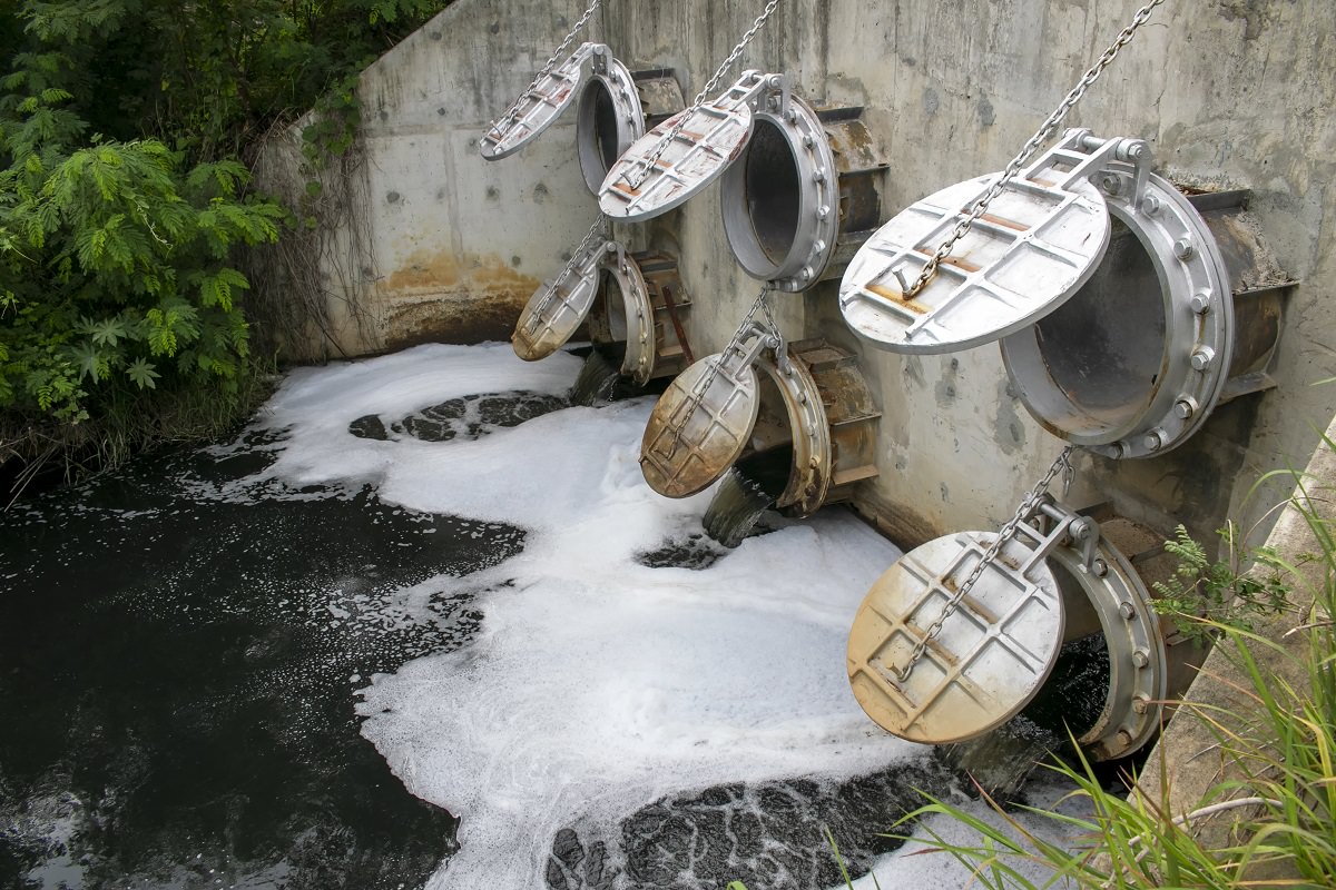 factory waste water flowing into river