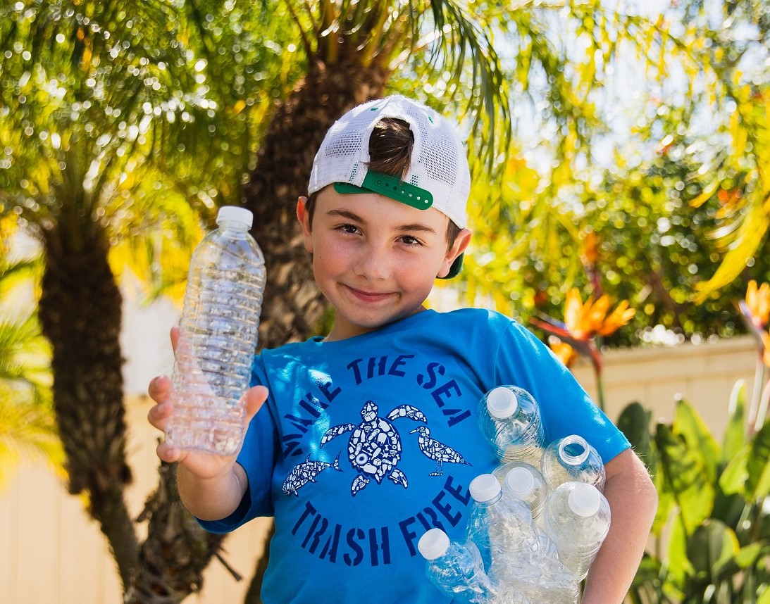 Ryan Hickman holding plastic bottles