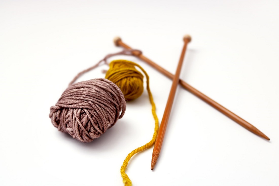 leftover yarn and knitting needles