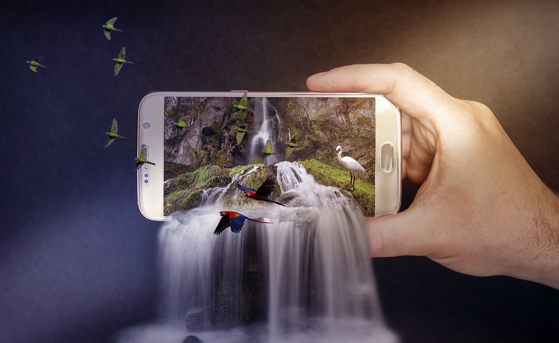 iphone with waterfall and birds escaping the screen