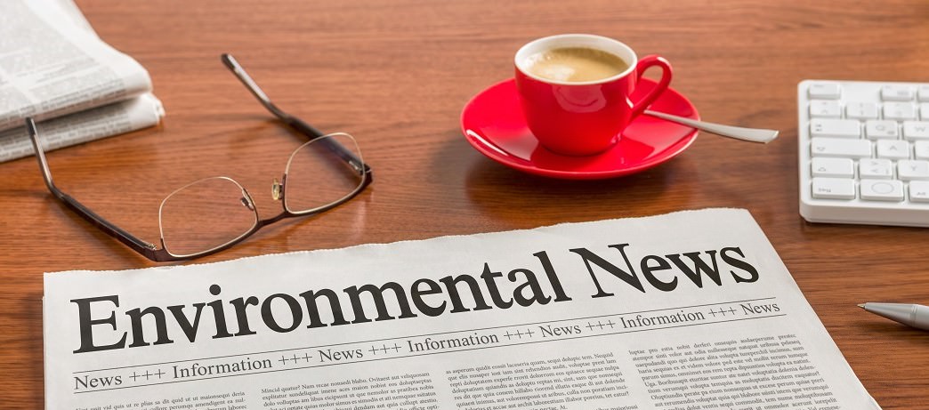 newspaper with headline "Environmental News"