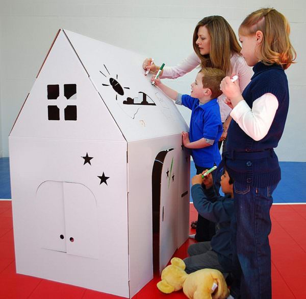 Children and adult decorate an Easy Playhouse