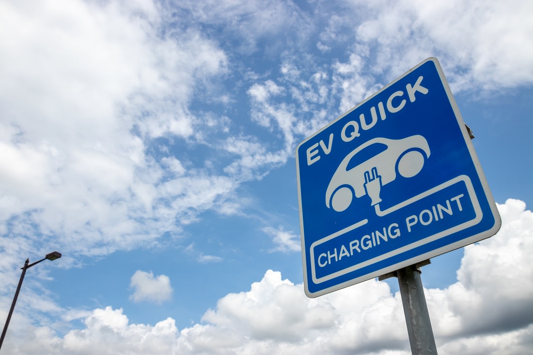 road sign for EV charging station
