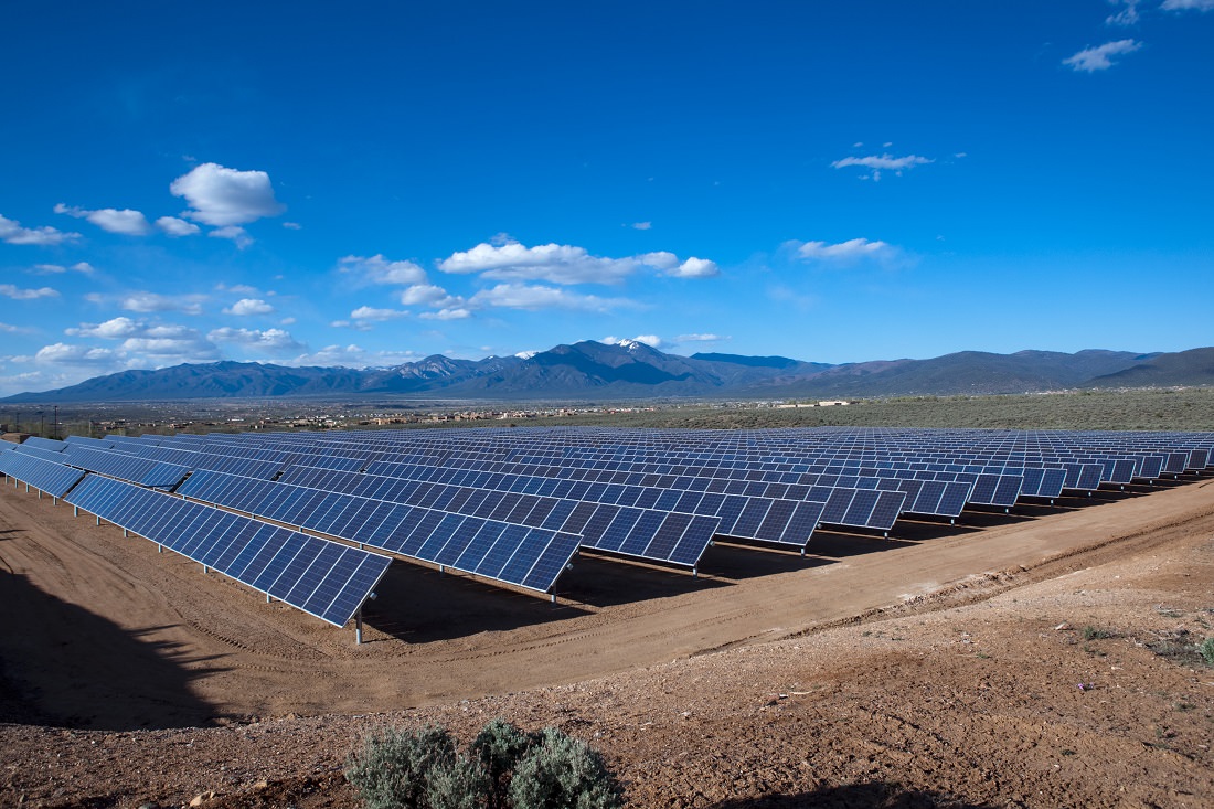 solar array with mountains in background