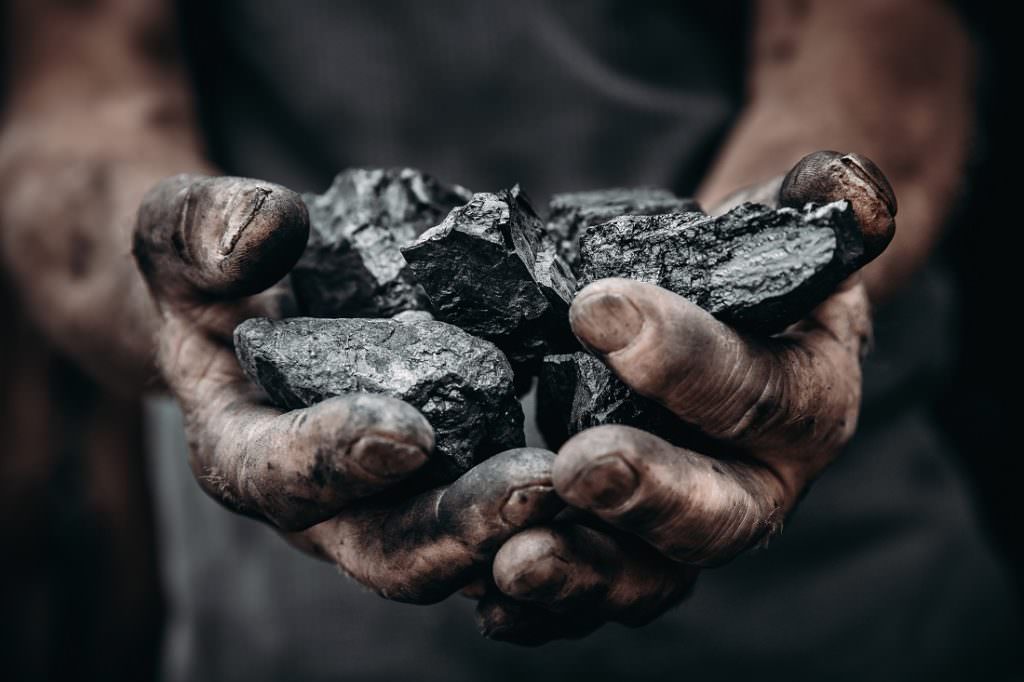 coal in miner's hands