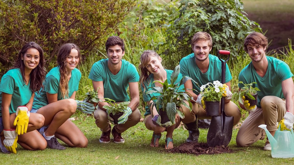 group of young adults gardening