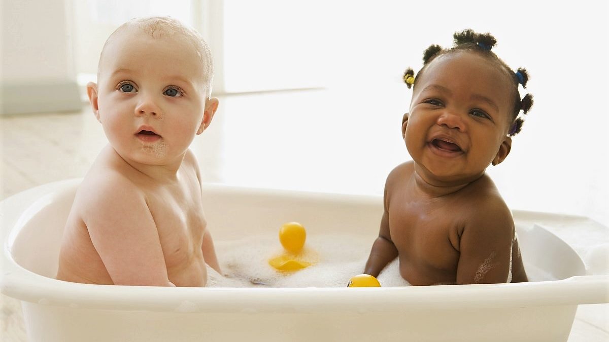two babies in bubble bath