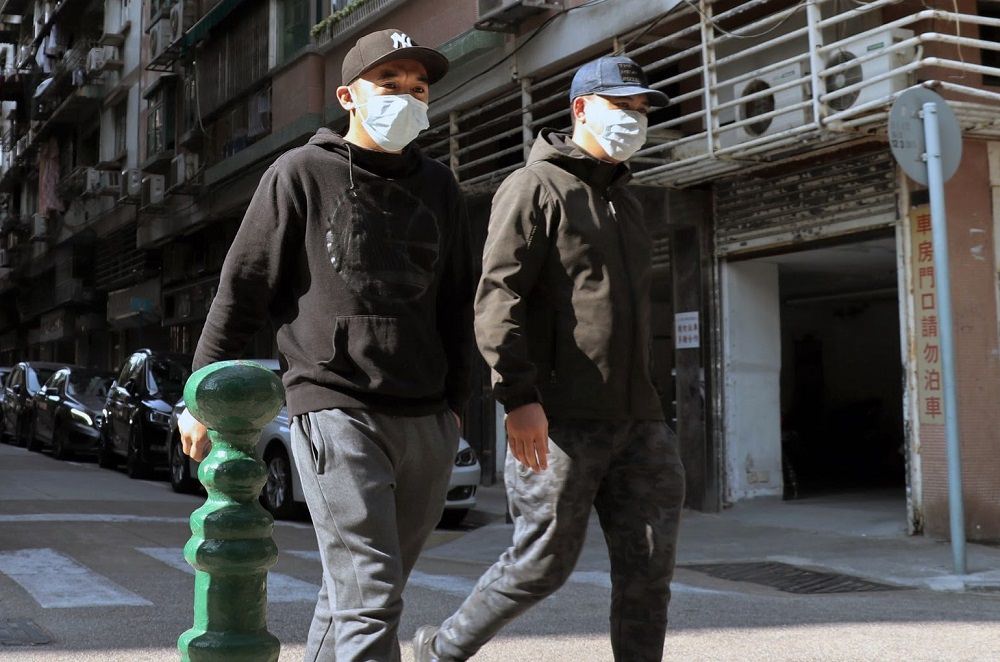 Two youths wearing face masks