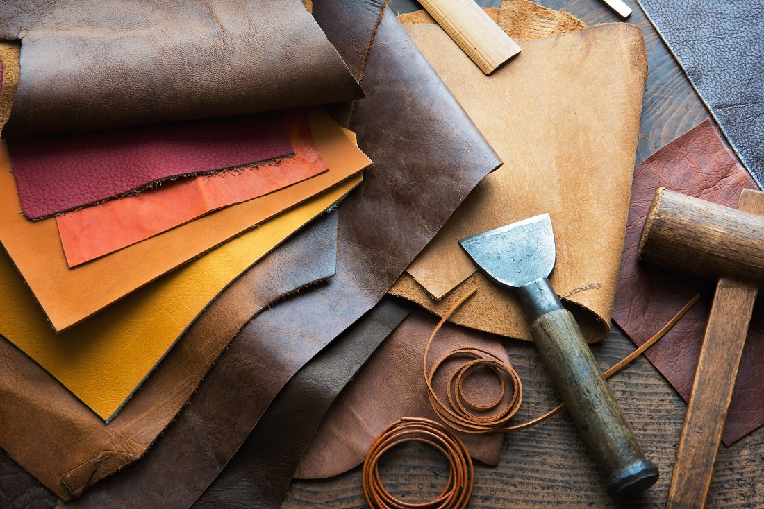 pieces of leather and leather working tools
