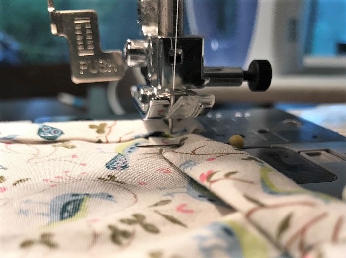 Sew a straight hem, picking up the sewing machine foot before you turn each corner.