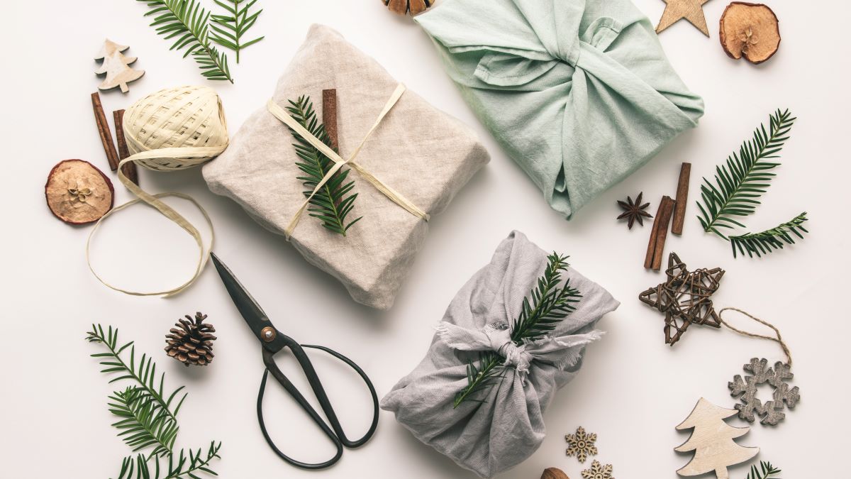 Fabric-wrapped gifts and natural holiday ornaments