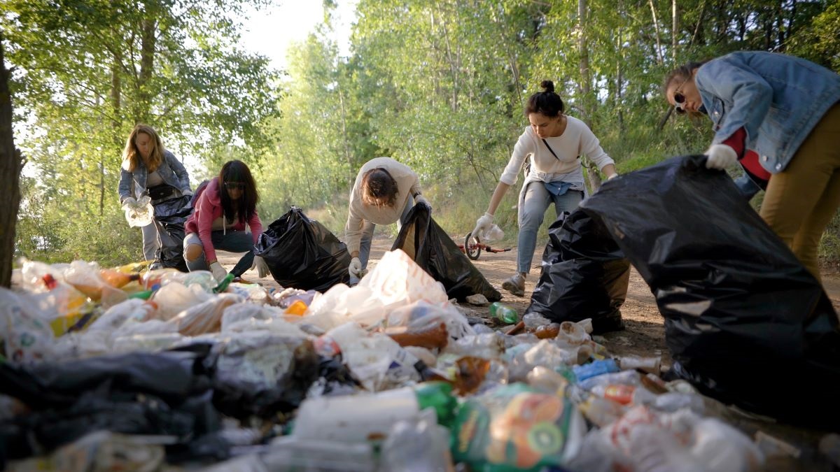 A group of volunteers picking up litter