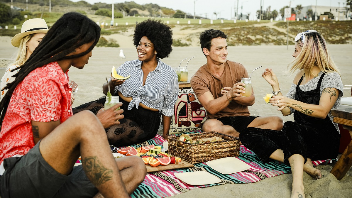 Friends having a picnic at the beach