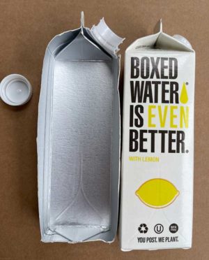 A Boxed Water Is Better carton opened to show the aluminum composite flavor barrier and bioplastic cap.
